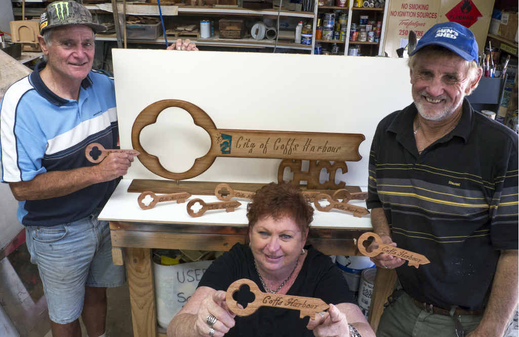 KEYS TO THE CITY: Men’s Shed craftsmen Ron Braun (left) and Tony Goninan, and the manager of Enterprise Coffs, Jenny Oloman, with the keys which will be presented this afternoon. KEYS TO THE CITY: Men’s Shed craftsmen Ron Braun (left) and Tony Goninan, and the manager of Enterprise Coffs, Jenny Oloman, with the keys which will be presented this afternoon.